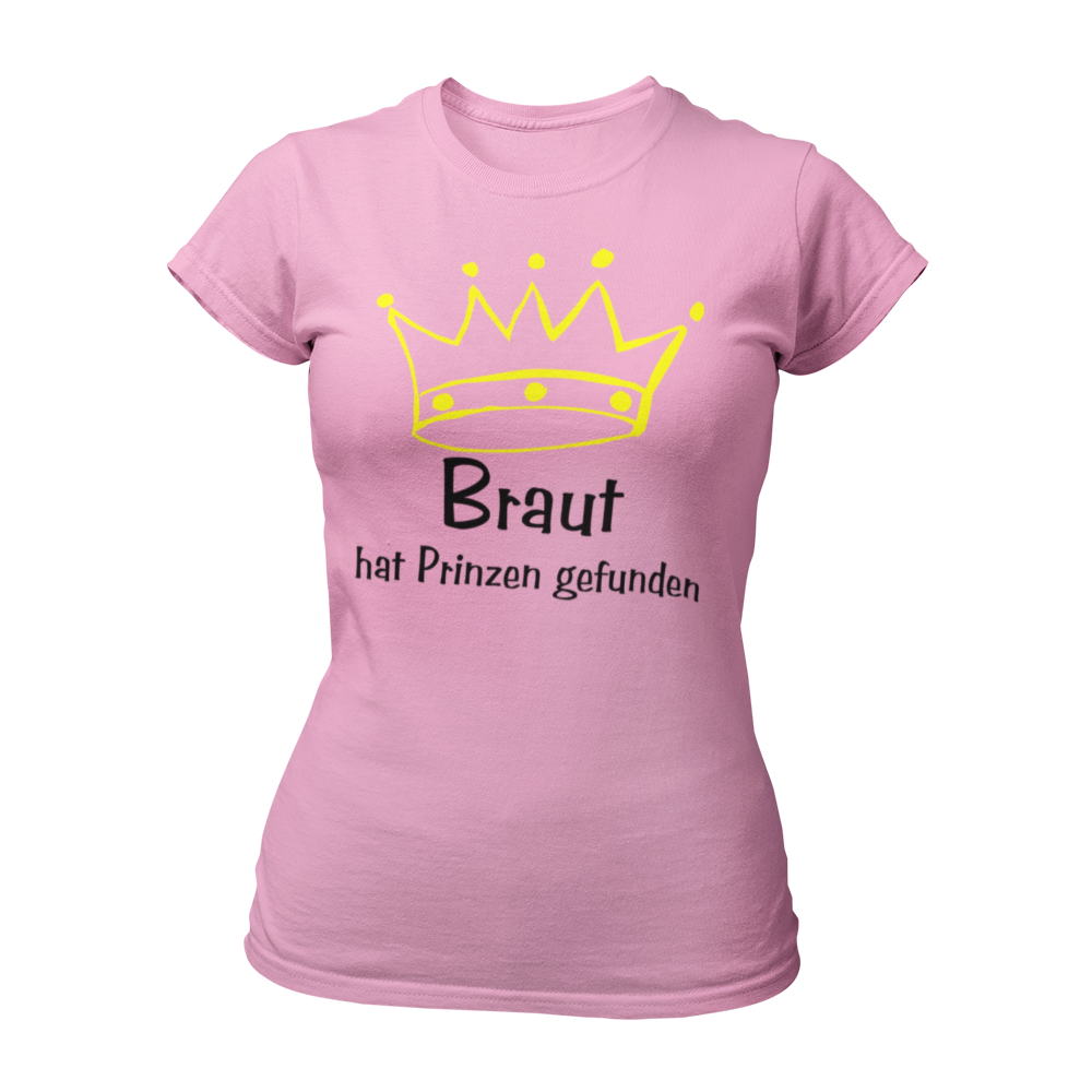 Damen-JGA T-Shirt für die Braut mit einer gelben Krone über dem verspielten pinken Schriftzug "Braut". Der Zusatz "hat ihren Prinzen gefunden" unterstreicht das Prinzessin-Feeling und den Anlass des Junggesellinnenabschieds. Das Shirt ist ideal für die Braut und kann mit passenden Motiven für die Brautmädels kombiniert werden, um ein einheitliches Outfit für die Feier zu schaffen.