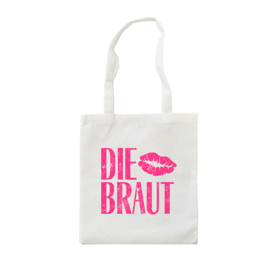 JGA Beutel „Die Braut“ im Vintage-Stil, weiß mit pinkem Aufdruck. Die Tasche misst 38 cm x 42 cm und zeigt den Schriftzug „Die Braut“ in dicken Buchstaben, ergänzt durch einen großen Kussmund. Ideal für die Aufbewahrung von Utensilien am Junggesellenabschied.