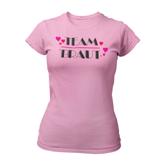 Damen T-Shirt "Team Braut Herzen" in pink und schwarz, das die Zugehörigkeit zum Team der Braut klar zeigt. Mit einem auffälligen, stilvollen Design, ist es perfekt für den Junggesellinnenabschied. Das Shirt kann mit passenden Shirts für die Braut oder auch mit Schärpen kombiniert werden.