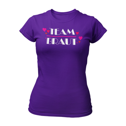 Damen T-Shirt "Team Braut Herzen" in pink und schwarz, das die Zugehörigkeit zum Team der Braut klar zeigt. Mit einem auffälligen, stilvollen Design, ist es perfekt für den Junggesellinnenabschied. Das Shirt kann mit passenden Shirts für die Braut oder auch mit Schärpen kombiniert werden.