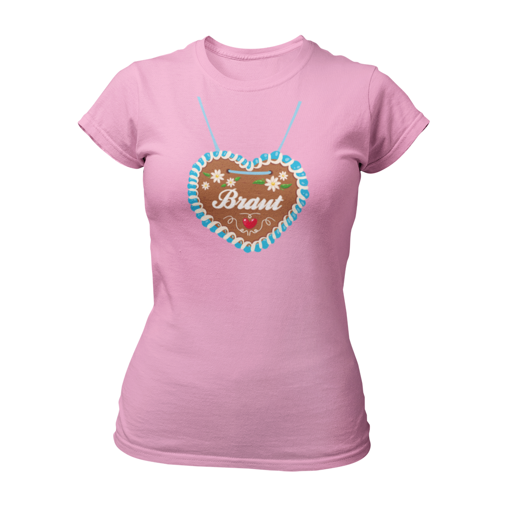 JGA T-Shirt "Lebkuchenherz (Braut)" für Damen, das durch ein auffälliges Design mit einem großen Lebkuchenherz-Aufdruck zum Blickfang auf Junggesellinnenabschieden wird. Das Shirt zeigt in verschnörkelten Buchstaben den Schriftzug "Braut" auf dem Herz. Erhältlich in verschiedenen Farben, bietet es eine taillierte Passform mit kurzen, anliegenden Ärmeln für angenehmen Tragekomfort. Perfekt für die gesamte Mädelsclique, die das "Lebkuchenherz Crew" Shirt trägt. Das Shirt lässt sich ideal mit verschiedenen Acc