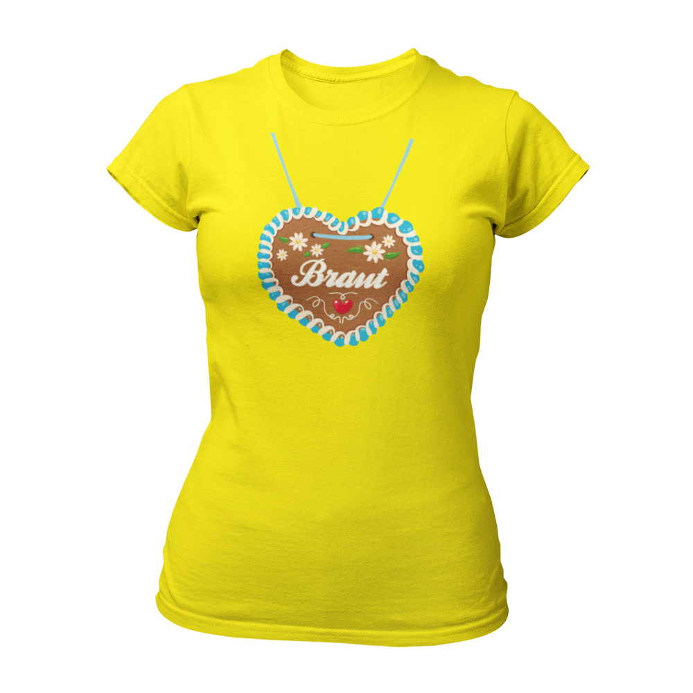 JGA T-Shirt "Lebkuchenherz (Braut)" für Damen, das durch ein auffälliges Design mit einem großen Lebkuchenherz-Aufdruck zum Blickfang auf Junggesellinnenabschieden wird. Das Shirt zeigt in verschnörkelten Buchstaben den Schriftzug "Braut" auf dem Herz. Erhältlich in verschiedenen Farben, bietet es eine taillierte Passform mit kurzen, anliegenden Ärmeln für angenehmen Tragekomfort. Perfekt für die gesamte Mädelsclique, die das "Lebkuchenherz Crew" Shirt trägt. Das Shirt lässt sich ideal mit verschiedenen Acc