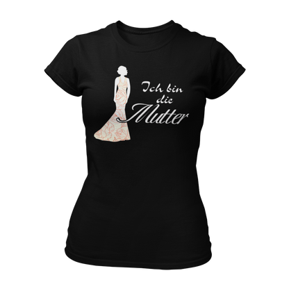 JGA T-Shirt 'Ich bin die Mutter' für die Mutter der Braut. Perfekt für den Junggesellenabschied, um ihre besondere Rolle zu feiern. Ideal in Kombination mit elegantem Abendkleid, um den Dresscode der Hochzeit anzudeuten.