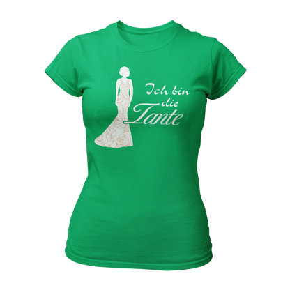 Damen T-Shirt mit der Aufschrift 'Ich bin die Tante' aus der Druckideen-Reihe 'Wer bin ich?'. Das Shirt zeigt eine stilisierte Tante in einem langen, eleganten Abendkleid und gibt einen ersten Eindruck von ihrem Hochzeitsoutfit. Teil einer Reihe, die auch die Designs 'Ich bin die Braut', 'Ich bin die Trauzeugin' und 'Ich bin die Schwester' umfasst. Dieses Shirt fördert das Kennenlernen und sorgt für Spaß beim Junggesellenabschied, während es Gespräche anregt