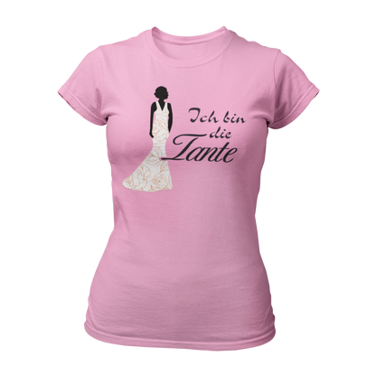 Damen T-Shirt mit der Aufschrift 'Ich bin die Tante' aus der Druckideen-Reihe 'Wer bin ich?'. Das Shirt zeigt eine stilisierte Tante in einem langen, eleganten Abendkleid und gibt einen ersten Eindruck von ihrem Hochzeitsoutfit. Teil einer Reihe, die auch die Designs 'Ich bin die Braut', 'Ich bin die Trauzeugin' und 'Ich bin die Schwester' umfasst. Dieses Shirt fördert das Kennenlernen und sorgt für Spaß beim Junggesellenabschied, während es Gespräche anregt