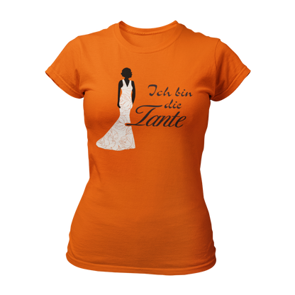 Damen T-Shirt mit der Aufschrift 'Ich bin die Tante' aus der Druckideen-Reihe 'Wer bin ich?'. Das Shirt zeigt eine stilisierte Tante in einem langen, eleganten Abendkleid und gibt einen ersten Eindruck von ihrem Hochzeitsoutfit. Teil einer Reihe, die auch die Designs 'Ich bin die Braut', 'Ich bin die Trauzeugin' und 'Ich bin die Schwester' umfasst. Dieses Shirt fördert das Kennenlernen und sorgt für Spaß beim Junggesellenabschied, während es Gespräche anregt