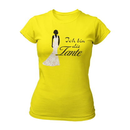 Damen T-Shirt mit der Aufschrift 'Ich bin die Tante' aus der Druckideen-Reihe 'Wer bin ich?'. Das Shirt zeigt eine stilisierte Tante in einem langen, eleganten Abendkleid und gibt einen ersten Eindruck von ihrem Hochzeitsoutfit. Teil einer Reihe, die auch die Designs 'Ich bin die Braut', 'Ich bin die Trauzeugin' und 'Ich bin die Schwester' umfasst. Dieses Shirt fördert das Kennenlernen und sorgt für Spaß beim Junggesellenabschied, während es Gespräche anregt