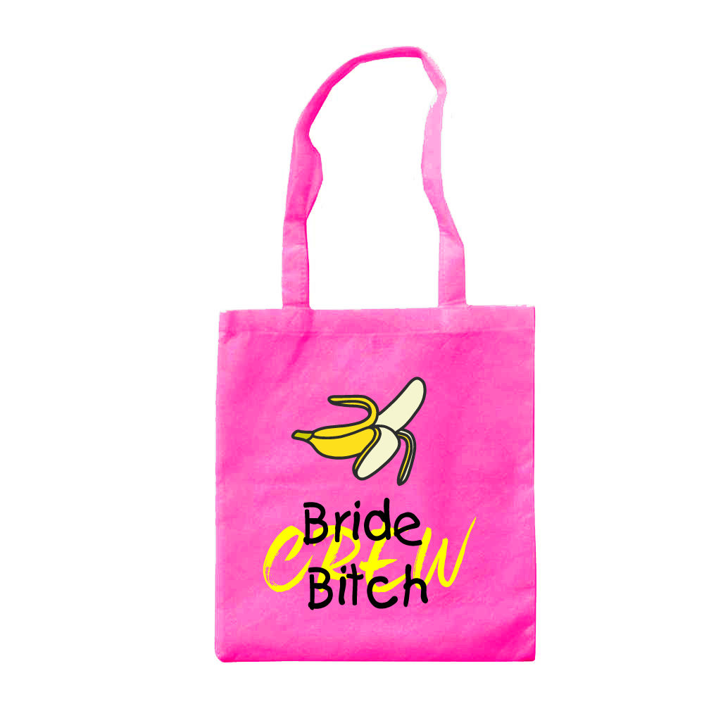 JGA Tasche "Bride Bitch Crew" aus Stoff, misst 42 cm x 38 cm und zeigt den Schriftzug „Bride Bitch Crew“ in Bananenfarbe auf pinkem oder weißem Hintergrund. Der große Beutel bietet ausreichend Platz für Accessoires und hat lange Henkel für bequemes Tragen.